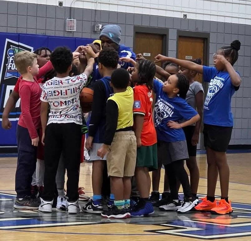 Bud Adail leading a youth huddle